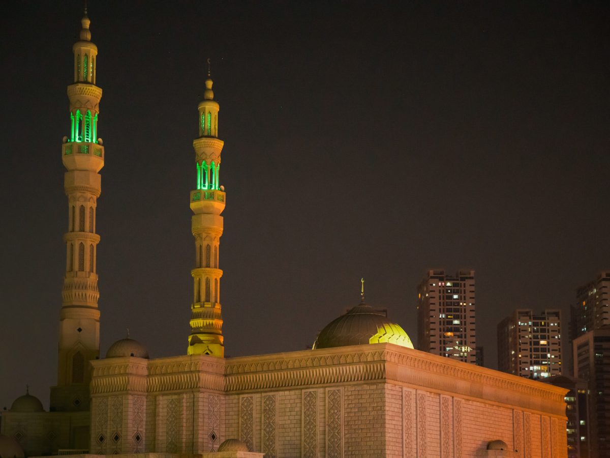 Night View Of Al Remeila Mosque, New Residential Multi-storey Houses In Ajman, United Arab Emirates.